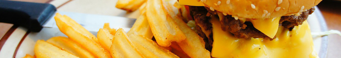 Eating American (Traditional) Burger Cafe at Yaga's Cafe restaurant in Galveston, TX.